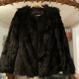 Women’s black faux fur jacket.